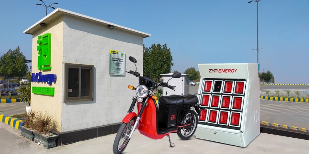 Electric motorcycle at an ACharge EV charging and ZYP battery swapping station.